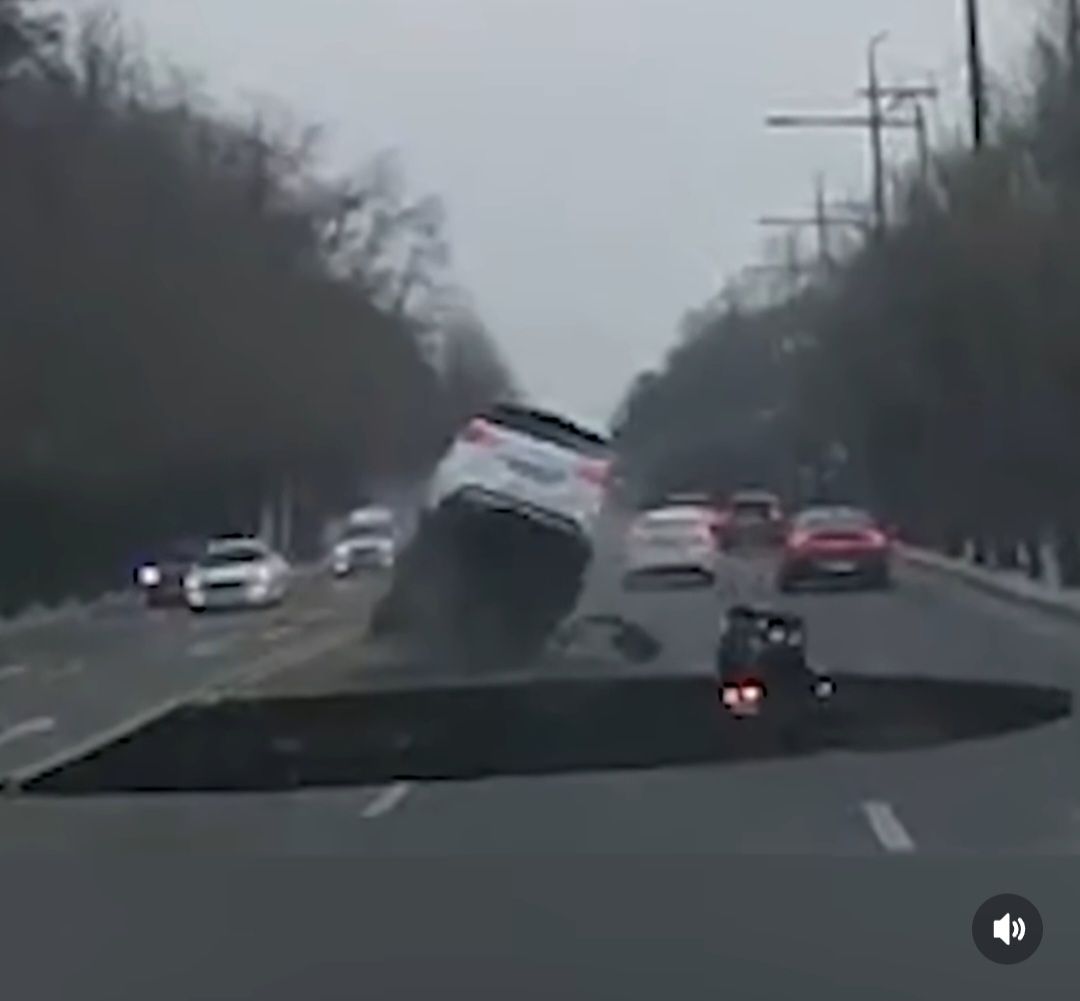 A motorcyclist in Seoul, South Korea, was engulfed by a massive sinkhole that opened suddenly on a an express road. 