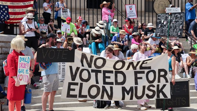 protesters demonstrating against Tesla CEO Elon Musk’s Department of Government Efficiency (DOGE)