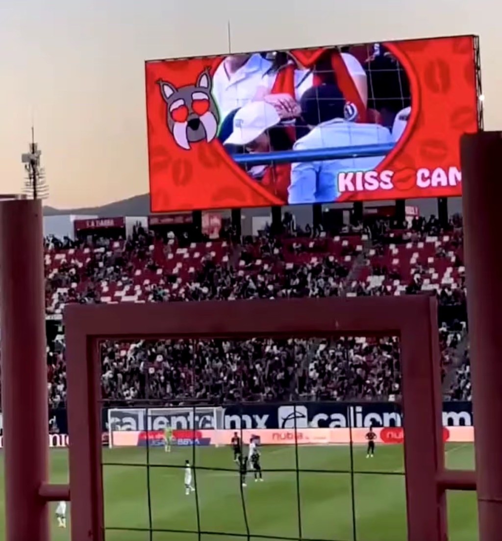 A couple suspected to be “cheating” have drawn comparisons to the viral&nbsp;Coldplay&nbsp;lovers after they were caught dramatically trying to hide from a kiss&nbsp;cam